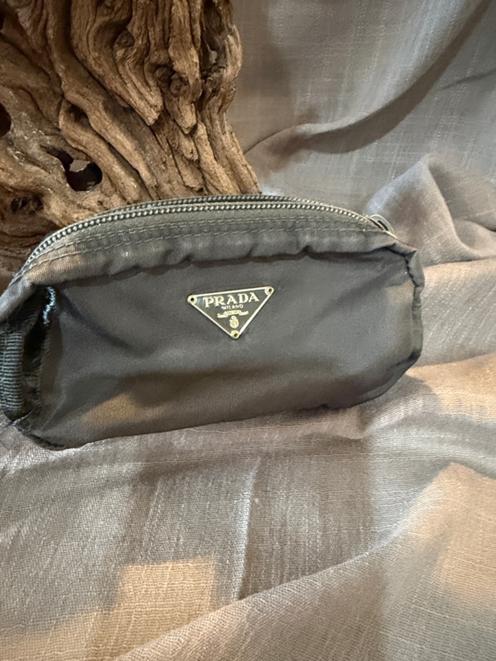 Authentic Prada Nylon Pouch needs a little work at her.